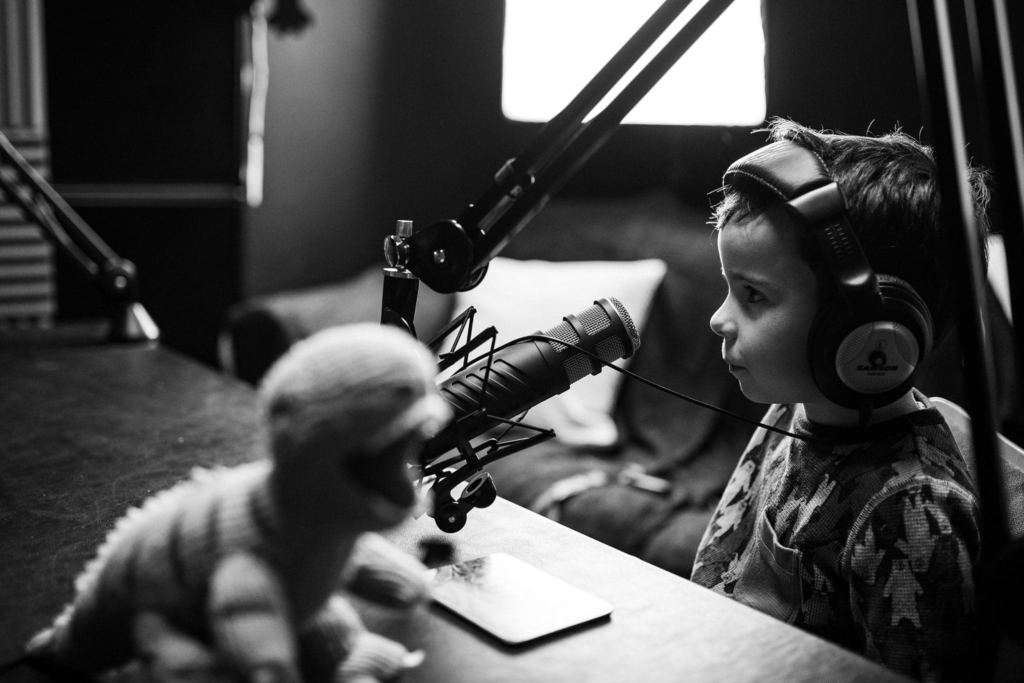 child listening with headphones using a microphone
